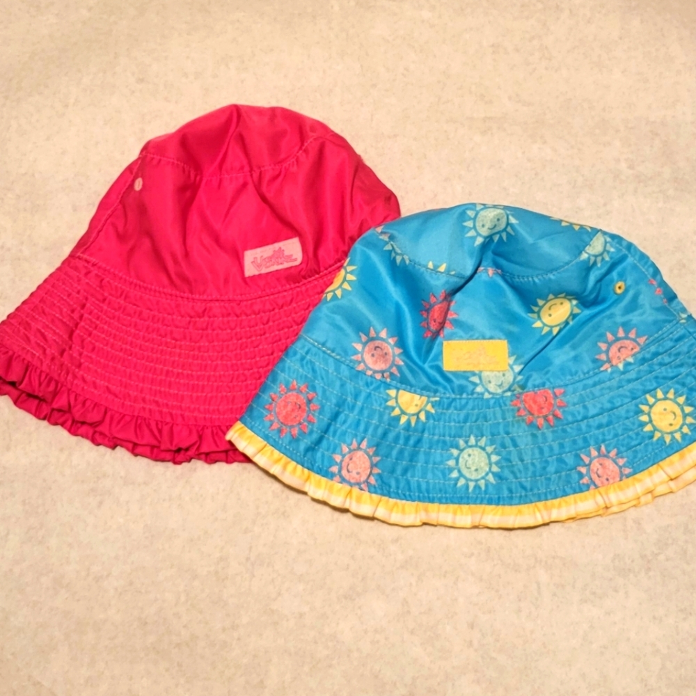 Two UV Skinz reversible bucket hats